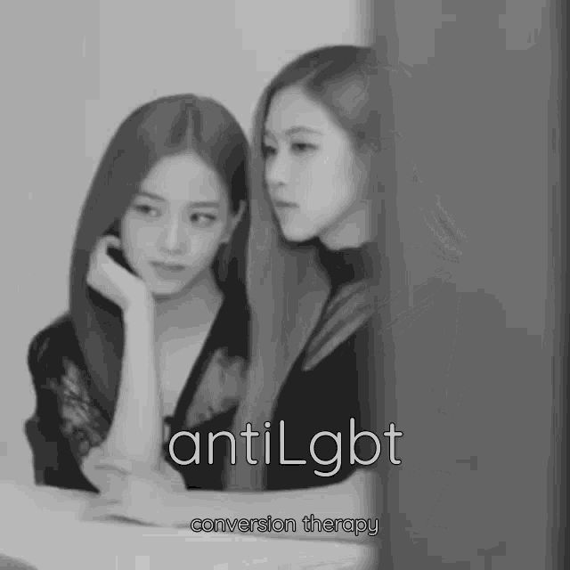 a black and white photo of two women with antilgbt conversion therapy written on the bottom