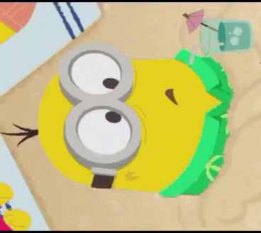 a cartoon minion is laying on the beach with a green shirt on .