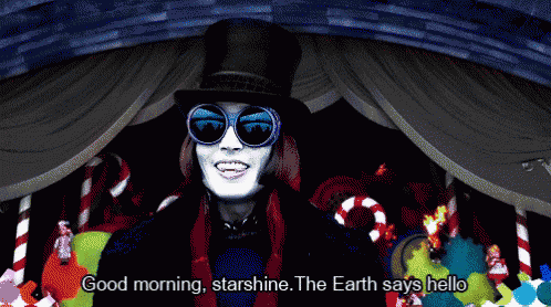 a man wearing sunglasses and a top hat says good morning starshine the earth says hello