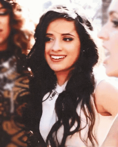 a close up of a woman 's face with a smile on her face