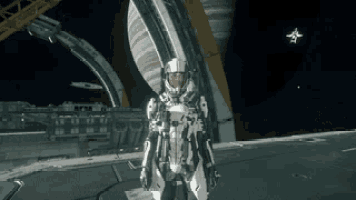 a man in a space suit is standing in front of a large building