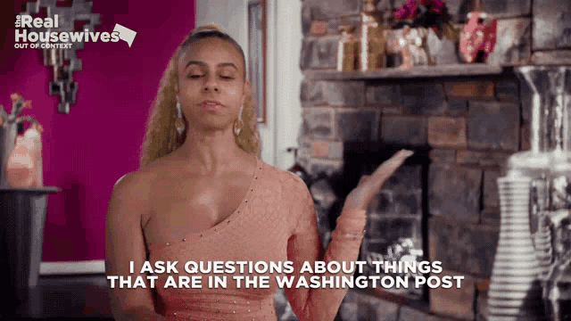 a woman is standing in front of a fireplace and says i ask questions about things that are in the washington post