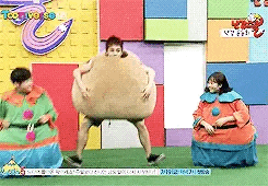 a group of people dressed up as potatoes are playing a game on a television show .