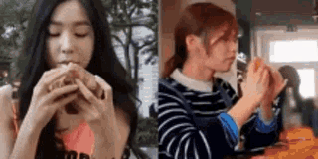 a woman is eating a hamburger and another woman is holding a sandwich .