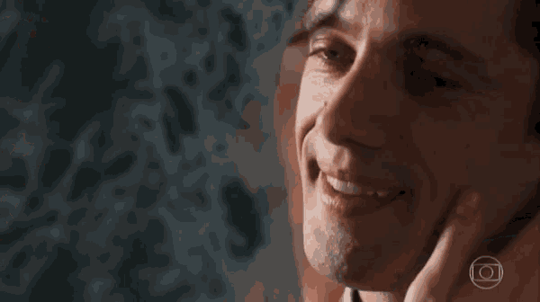 a close up of a man 's face with a circle in the middle of it