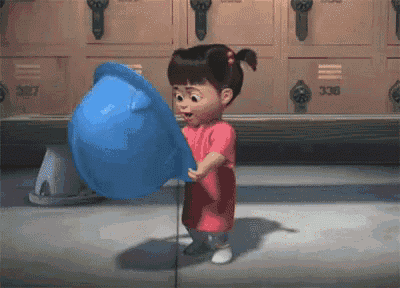 a little girl in a pink dress is holding a blue bowl in front of lockers with numbers 327 and 336 on them