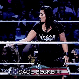 a woman in a wrestling ring with the name sage beckett on the banner