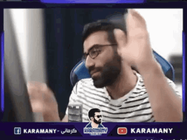 a man wearing glasses and a striped shirt is sitting in front of a computer screen with the words karamany on the bottom