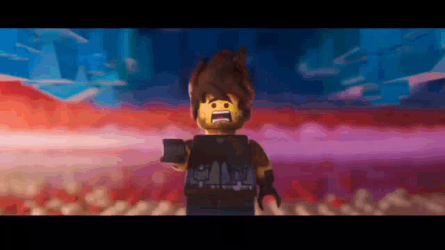 a lego man with a beard is standing in front of a crowd