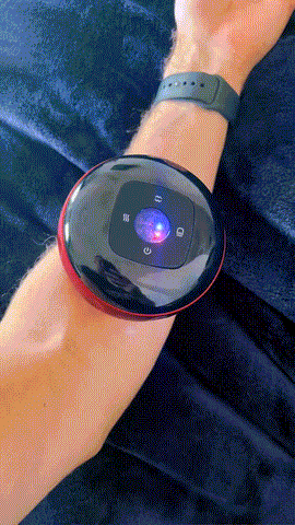 a person is wearing a watch on their wrist that has a button that says ' a ' on it