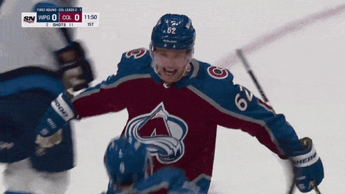 a hockey player wearing a jersey with the number 26 on it