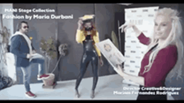 a man and two women are standing in front of a sign that says mani stage collection fashion by maria durboni