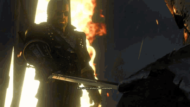 a man is holding a sword in front of a fire and says " bana bir şey anlatacaksin söylemiştim "