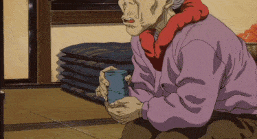 a woman in a pink sweater is holding a blue cup