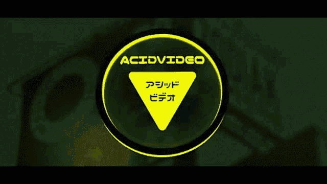 a yellow sign with a triangle in the middle says acidvideo
