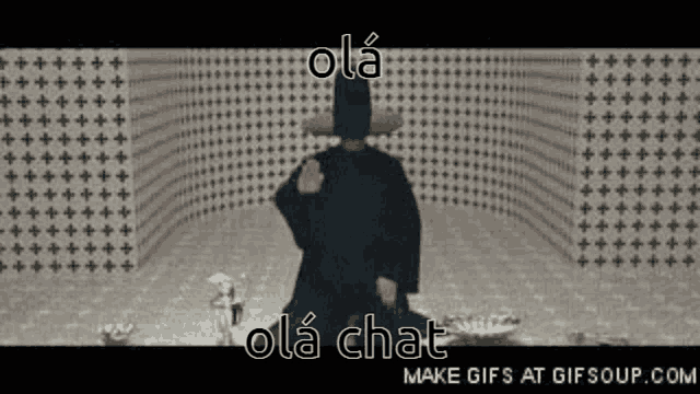 a man in a cowboy hat is standing in a room with a lot of dots on it .