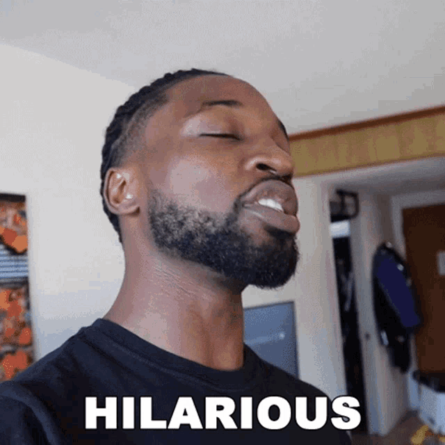 a man with a beard is making a funny face and the word hilarious is above him