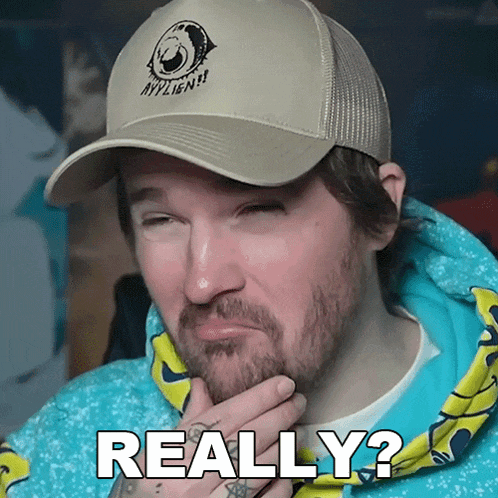 a man with a beard wearing a hat and a hoodie says " really "