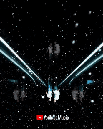 a man and a woman are standing next to each other with a youtube music logo in the corner