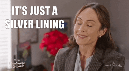 a woman is smiling with her eyes closed and says it 's just a silver lining