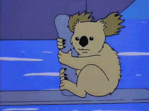 a cartoon koala bear is holding a piece of paper in its paws .