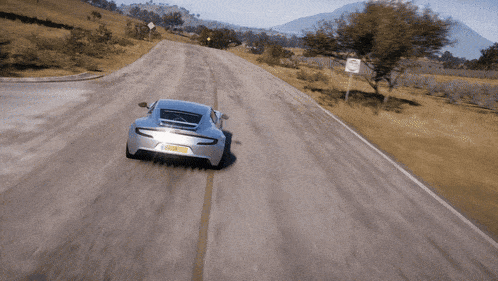 a silver sports car with a license plate that says mason
