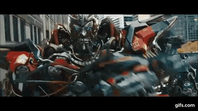 Sentinel Prime Kills Ironhide Transformers Film GIF - Sentinel Prime Kills Ironhide Transformers Film Fight GIFs