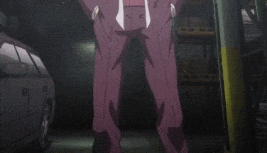 a man in a purple suit is standing with his hands on his hips