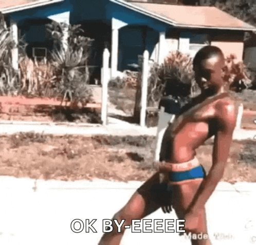a man in a bikini is walking down the street and says `` ok by eeee '' .