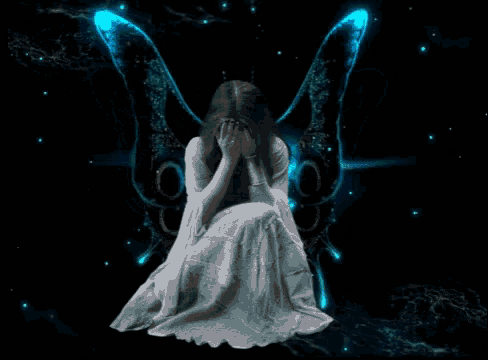 a woman in a white dress is sitting in front of a butterfly