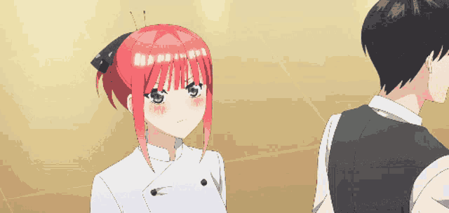 a girl with red hair is standing next to a boy
