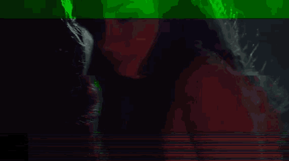 a blurry picture of a woman 's face with green and red lines