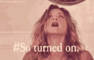 a close up of a woman 's face with the words `` so turned on '' written below her .