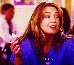 a woman wearing a blue shirt with ctv written on the front