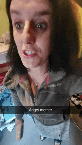 a woman taking a selfie with the words angry mother on the bottom