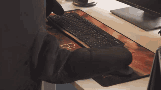 two dell monitors are sitting on a desk