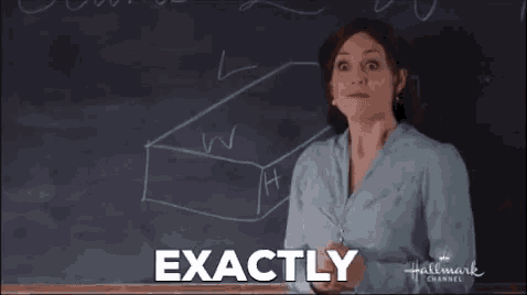 a woman is standing in front of a blackboard with a box drawn on it and says `` exactly '' .
