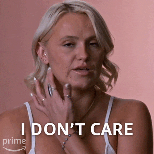 a woman in a white tank top says i don t care