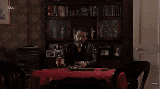 Peter Sits Alone At A Table And Pours A Whiskey Coronation Street GIF - Peter Sits Alone At A Table And Pours A Whiskey Coronation Street Peter Barlow GIFs