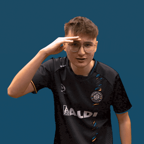 a young man wearing a black shirt that says aldi