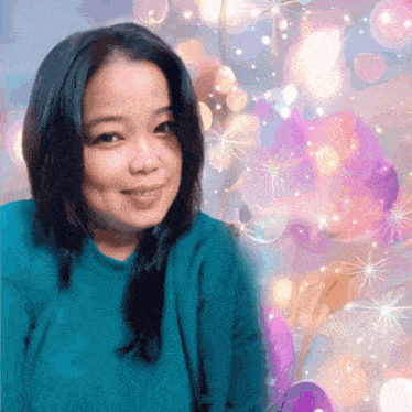 a woman in a blue sweater stands in front of a purple background