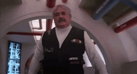 a man wearing a vest that says ' i.c.i.i. ' on it