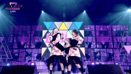 a group of people are dancing on a stage with the words live on the bottom