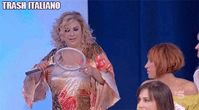 a woman holding a magnifying glass with trash italiano written on the top