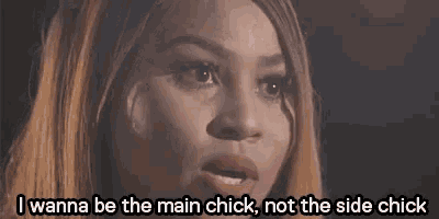 a close up of a woman 's face with the words `` i wanna be the main chick , not the side chick ''