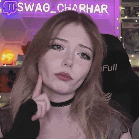 a woman is making a face in front of a sign that says swag charhar