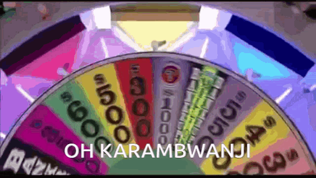 a colorful spinning wheel with the words oh karambwanji on the bottom