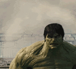 a close up of a man in a hulk costume with a serious look on his face .