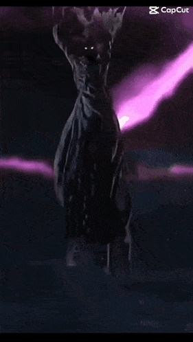 a purple light is coming out of a hole in the dark .