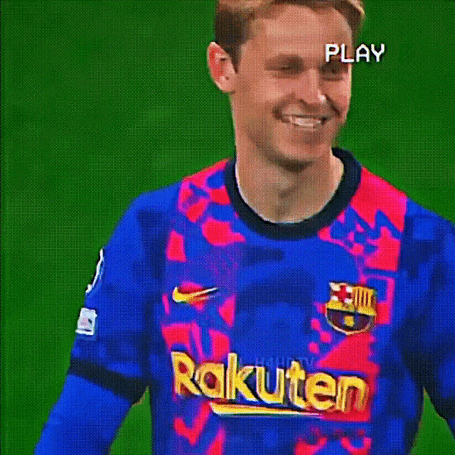 a soccer player wearing a blue and red jersey with the word kuten on the front